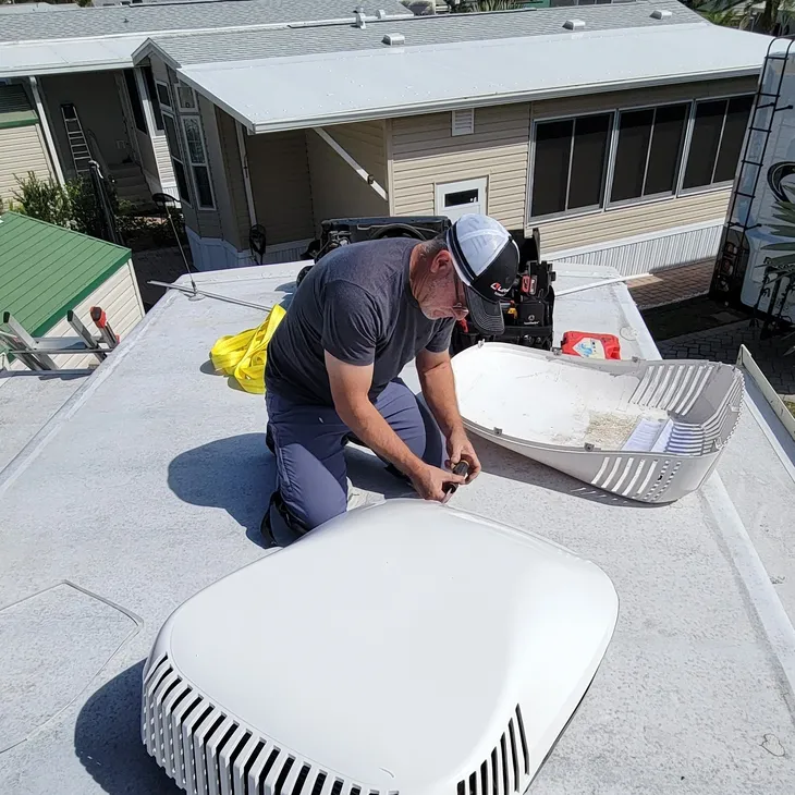 Danny working on an RV rooftop AC unit